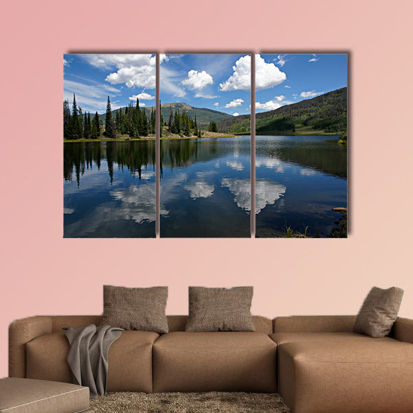 In this scene, afternoon clouds reflect from Pearl Lake multi panel canvas wall art