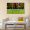 Golf course putting green with flag in autumn colors Multi Panel Canvas Wall Art