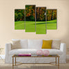 Golf course putting green with flag in autumn colors Multi Panel Canvas Wall Art