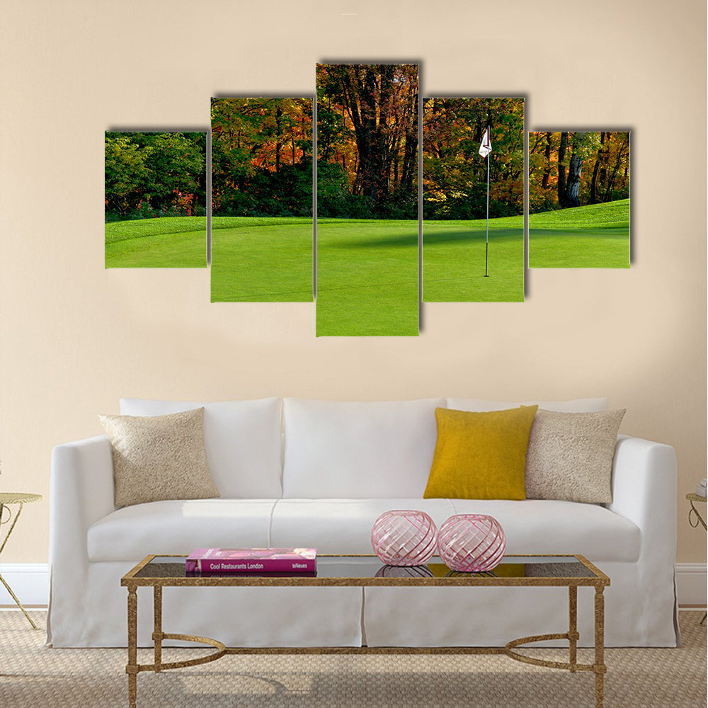Golf course putting green with flag in autumn colors Multi Panel Canvas Wall Art