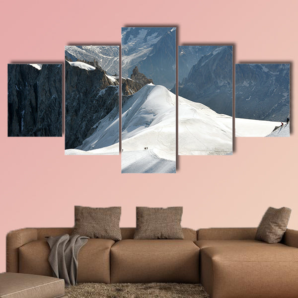 View of a range of high Alps and few mountaineers on a snow slope. Multi panel canvas wall art