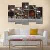 street lanterns in park at winter night Multi panel canvas wall art