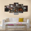 street lanterns in park at winter night Multi panel canvas wall art