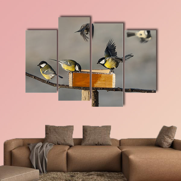 Titmouse birds eating seed from bird feeder multi panel canvas wall art