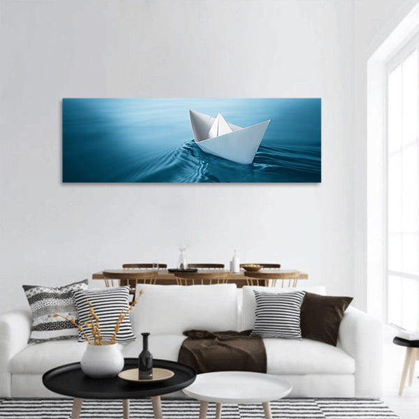 Origami paper sailboat sailing on blue water panoramic canvas wall art