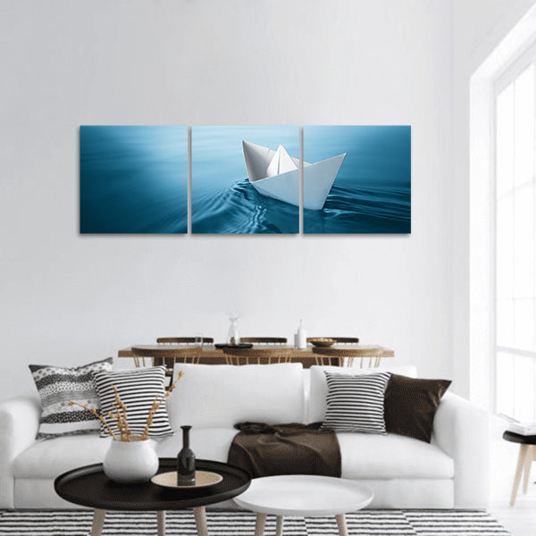 Origami paper sailboat sailing on blue water panoramic canvas wall art