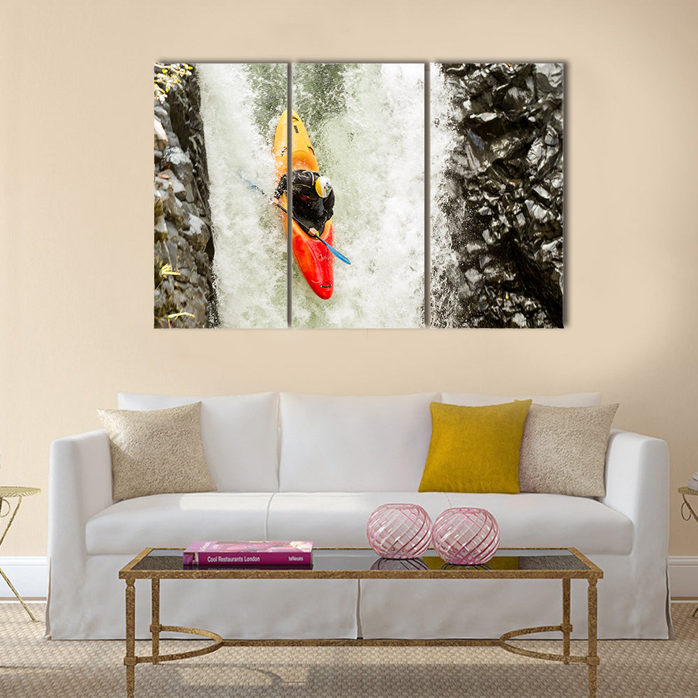 courageous kayaker in a vertical diving position Multi panel canvas wall art