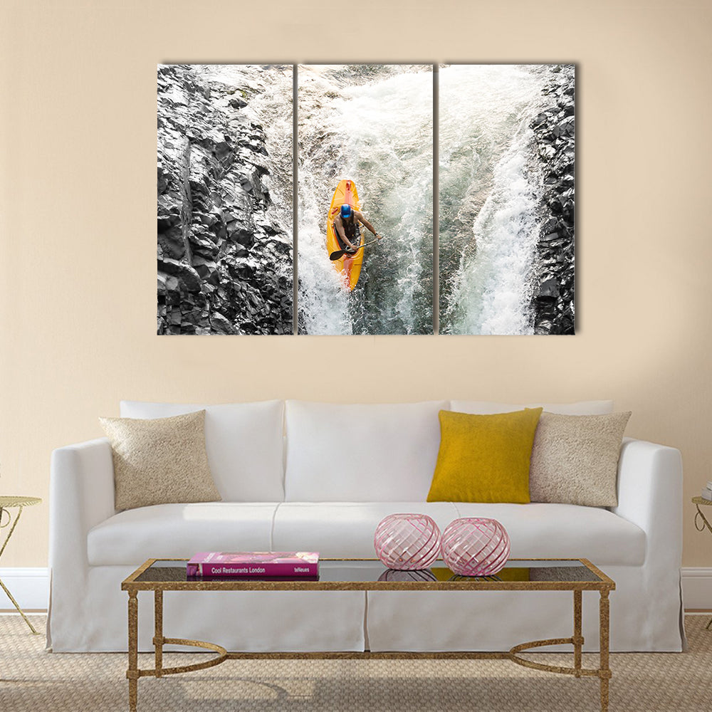 courageous kayaker in a vertical diving position Multi panel canvas wall art