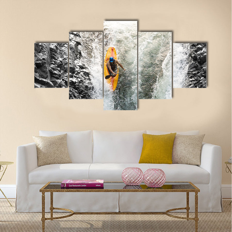 courageous kayaker in a vertical diving position Multi panel canvas wall art