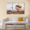 Hot air balloon flying over rock landscape at Cappadocia Turkey, multi panel canvas wall art