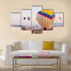 Hot air balloon flying over rock landscape at Cappadocia Turkey, multi panel canvas wall art