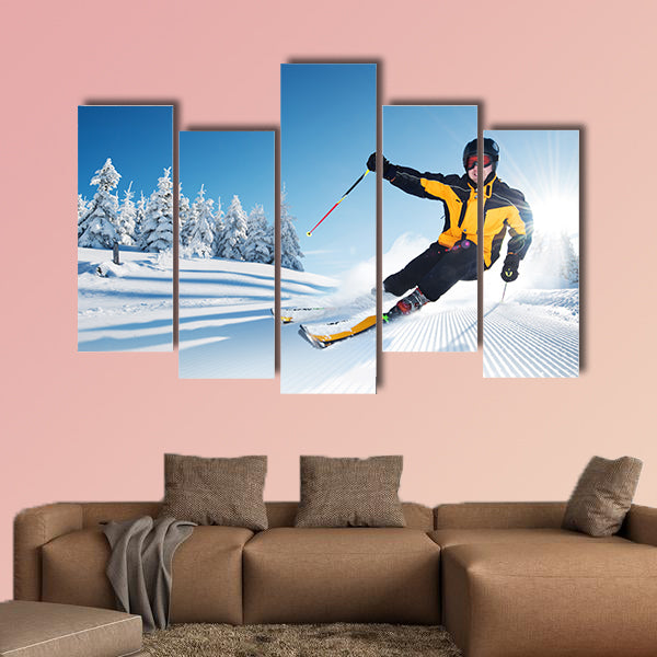 Skier in mountains, prepared piste and sunny day Multi panel canvas wall art