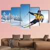 Skier in mountains, prepared piste and sunny day Multi panel canvas wall art