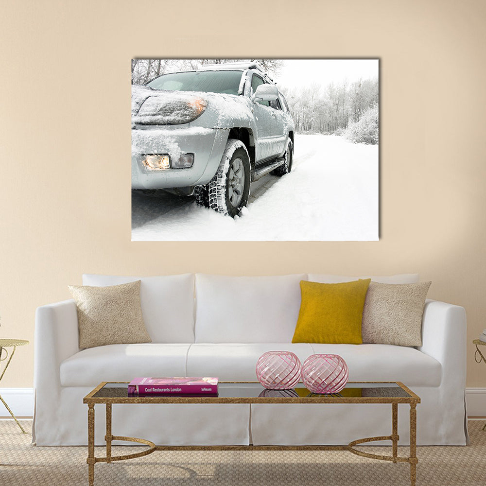 Snowy winter road behind an unrecognizable car Multi panel canvas wall art