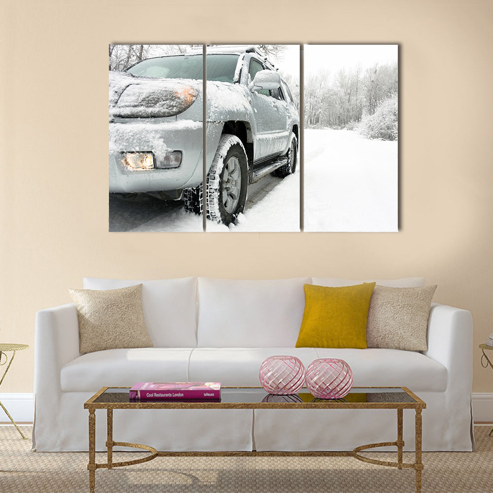 Snowy winter road behind an unrecognizable car Multi panel canvas wall art