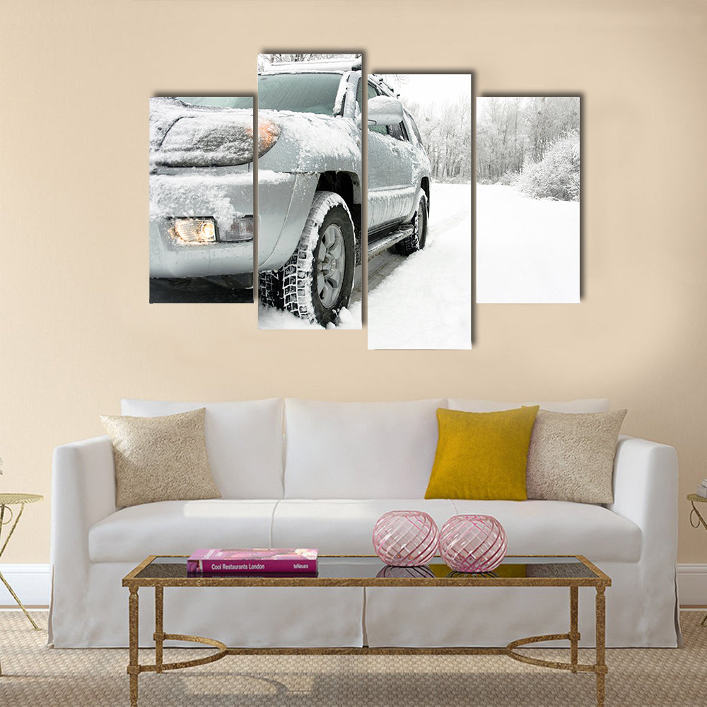 Snowy winter road behind an unrecognizable car Multi panel canvas wall art