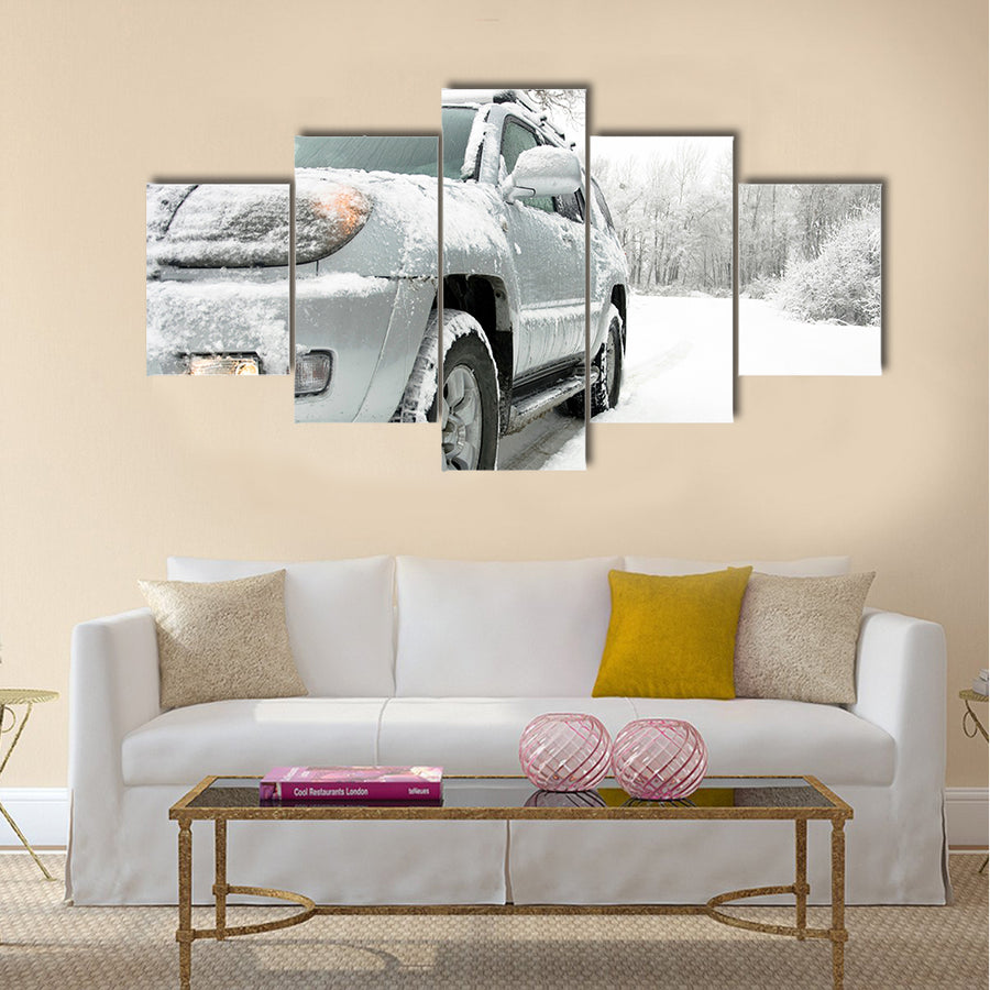 Snowy winter road behind an unrecognizable car Multi panel canvas wall art