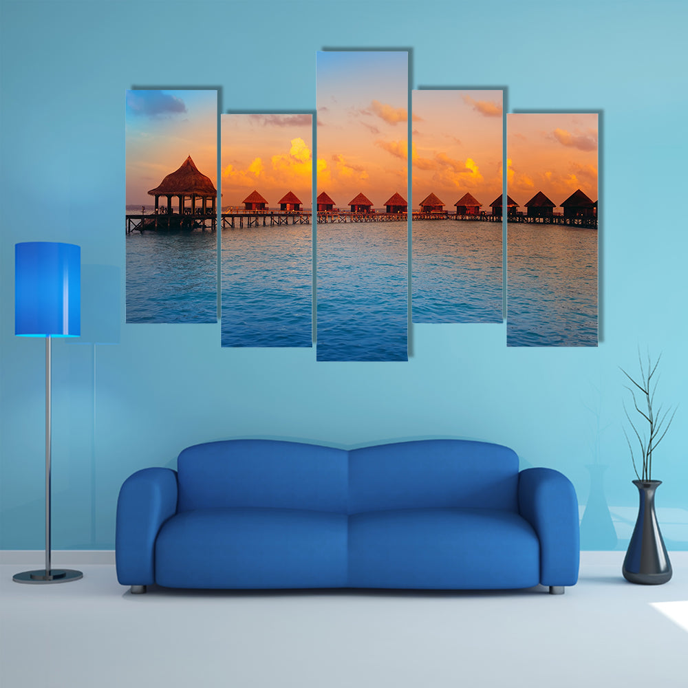 The Houses On Piles On Water At The Time Of Sunset Multi Panel Canvas Wall Art
