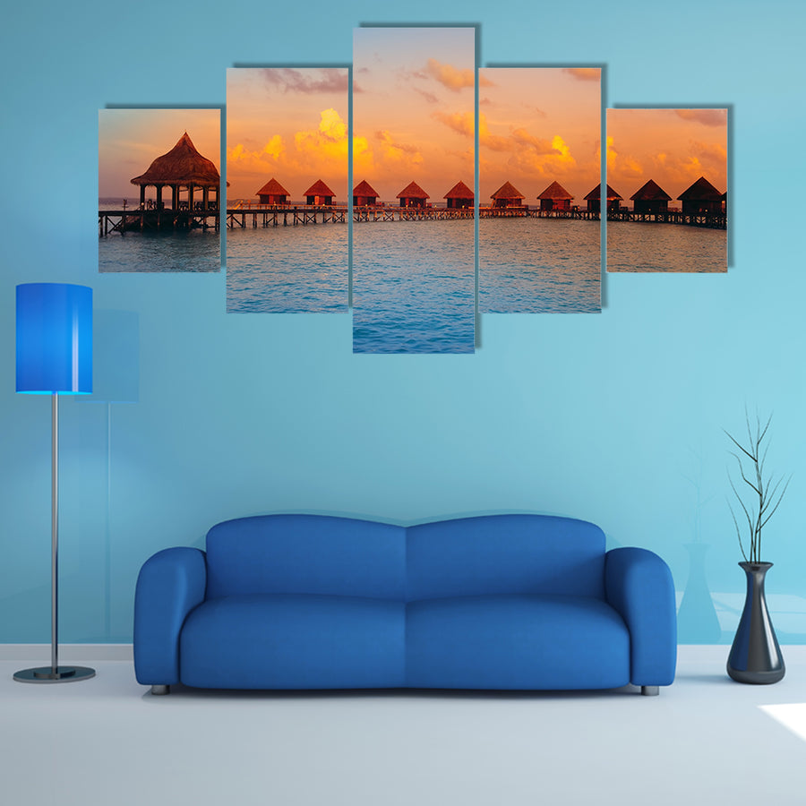 The Houses On Piles On Water At The Time Of Sunset Multi Panel Canvas Wall Art