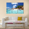 Speed boat on the beach of coco island, Seychelles Multi panel canvas wall art