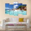 Speed boat on the beach of coco island, Seychelles Multi panel canvas wall art