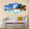 Speed boat on the beach of coco island, Seychelles Multi panel canvas wall art