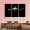 Close Up of Young Sports Man isolated on black background Multi panel canvas wall art