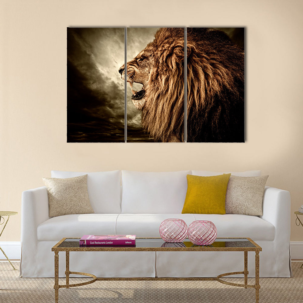 Roaring lion against stormy sky Multi panel canvas wall art