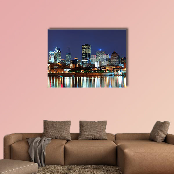Montreal over river at dusk with city lights and urban buildings wall art