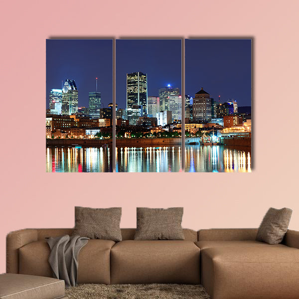 Montreal over river at dusk with city lights and urban buildings wall art
