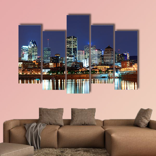 Montreal over river at dusk with city lights and urban buildings wall art