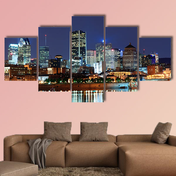 Montreal over river at dusk with city lights and urban buildings wall art