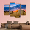 End of day over field with hay bale in Hungary multi panel canvas wall art