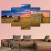 End of day over field with hay bale in Hungary multi panel canvas wall art