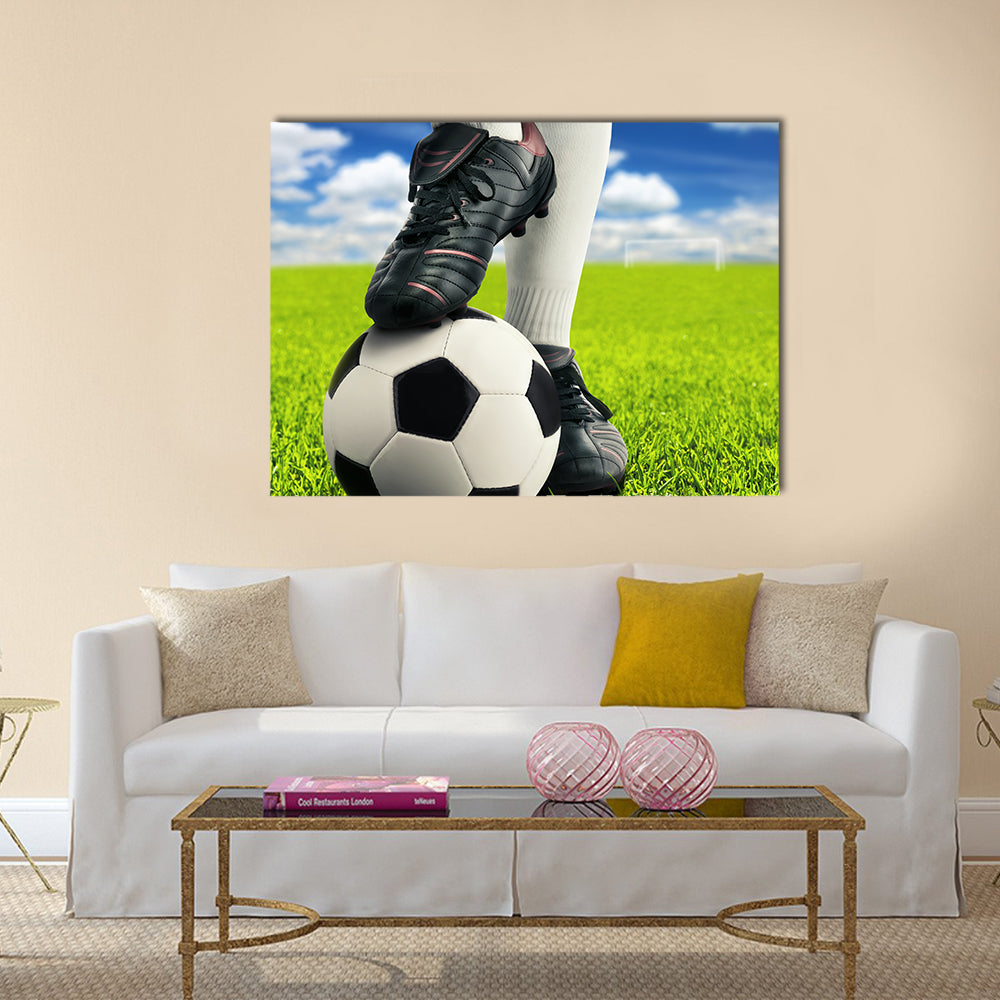 Soccer player on green grass Multi panel canvas wall art