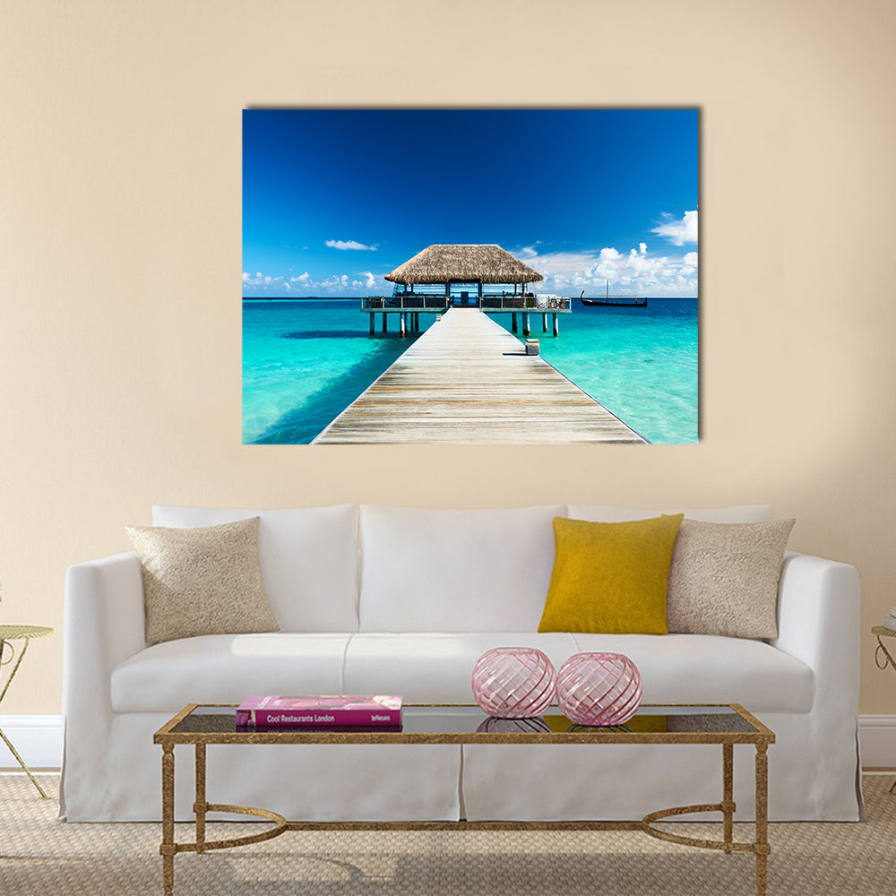 Beautiful beach with jetty at Maldives multi panel canvas wall art