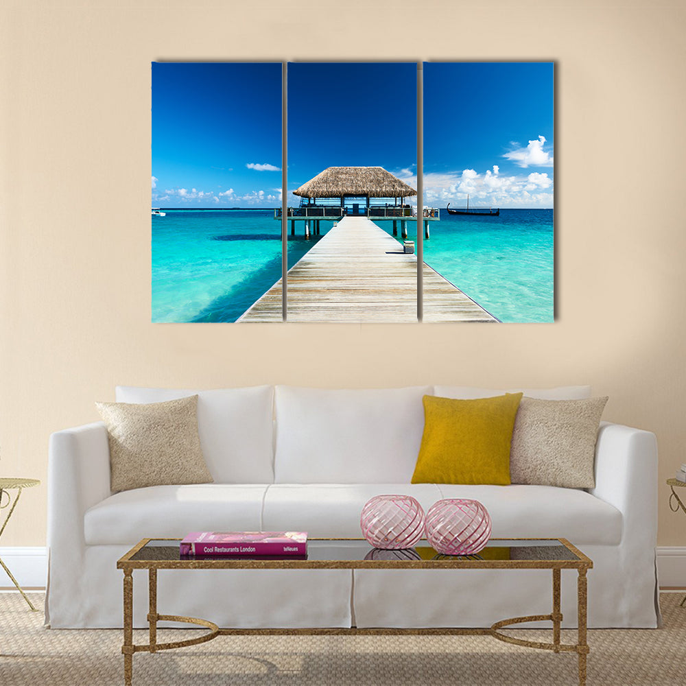 Beautiful beach with jetty at Maldives multi panel canvas wall art
