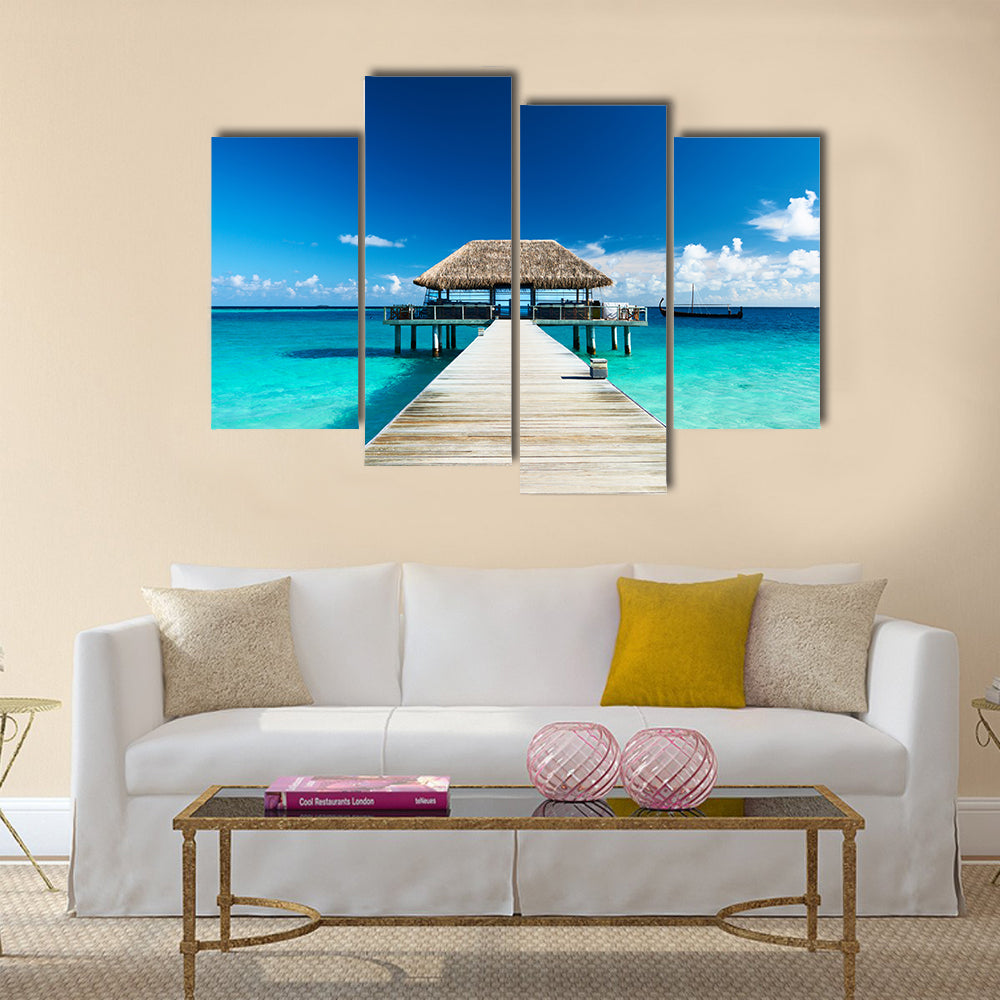 Beautiful beach with jetty at Maldives multi panel canvas wall art