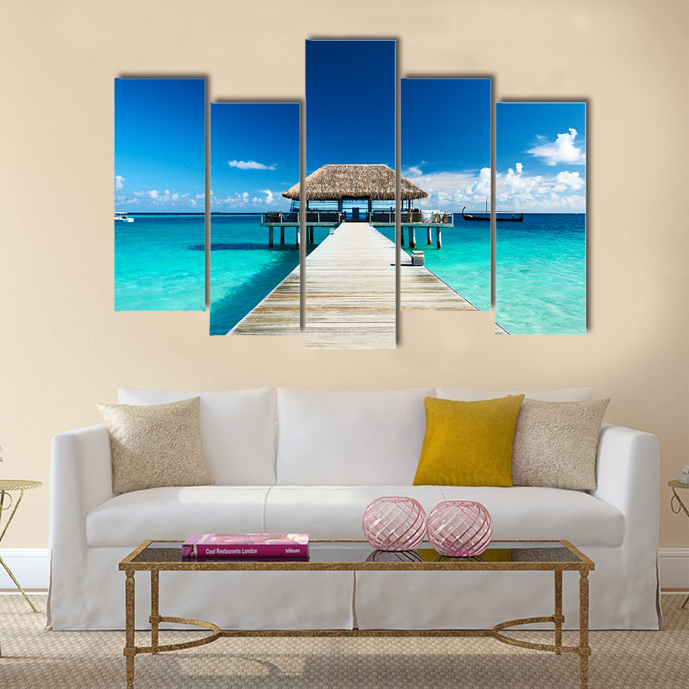 Beautiful beach with jetty at Maldives multi panel canvas wall art