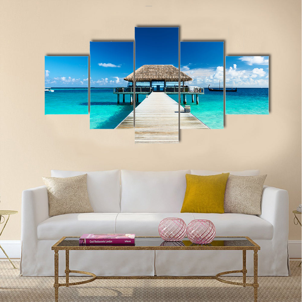 Beautiful beach with jetty at Maldives multi panel canvas wall art