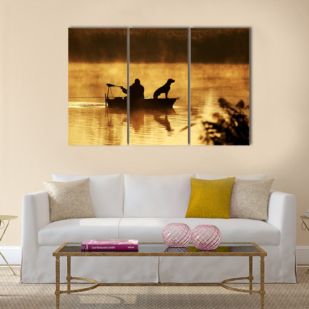 Silhouette of fisher and dog sitting in boat multi panel canvas wall art