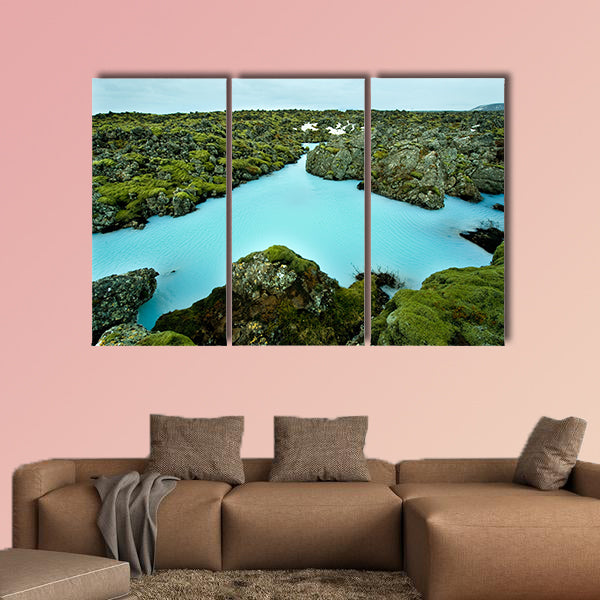 The blue water between the lava stones of Iceland canvas wall art