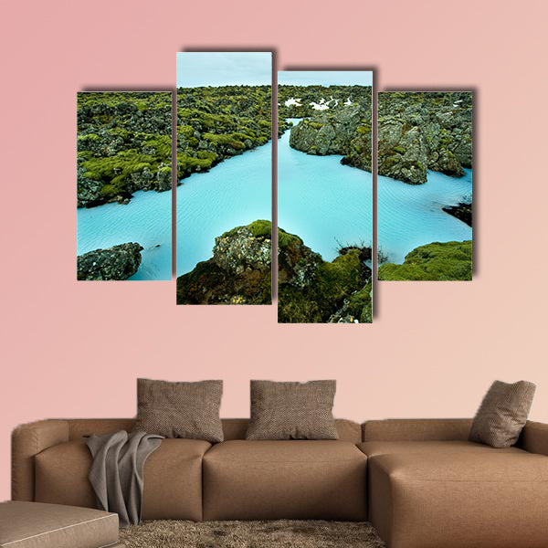The blue water between the lava stones of Iceland canvas wall art