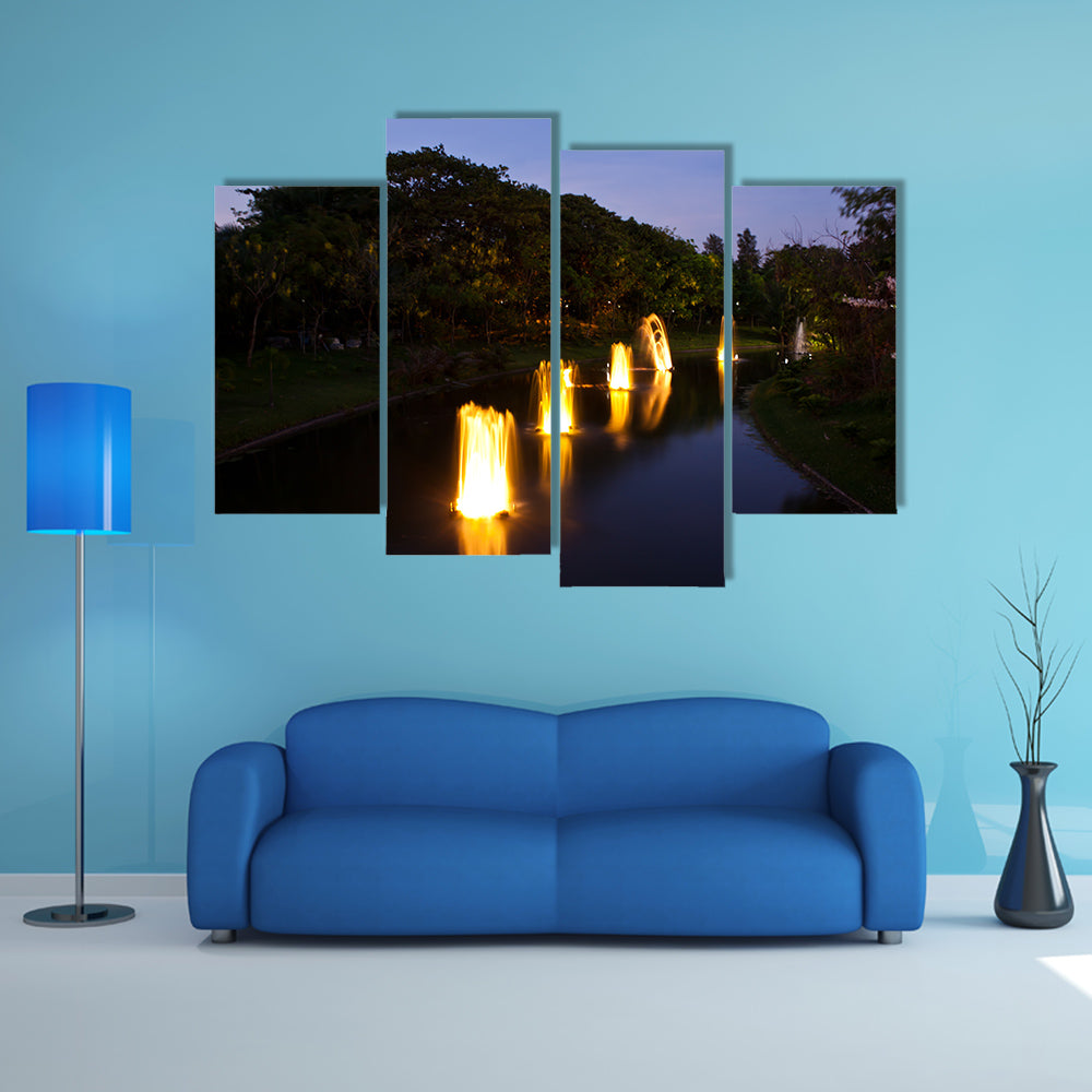 Fountain in garden at night time multi panel canvas wall art