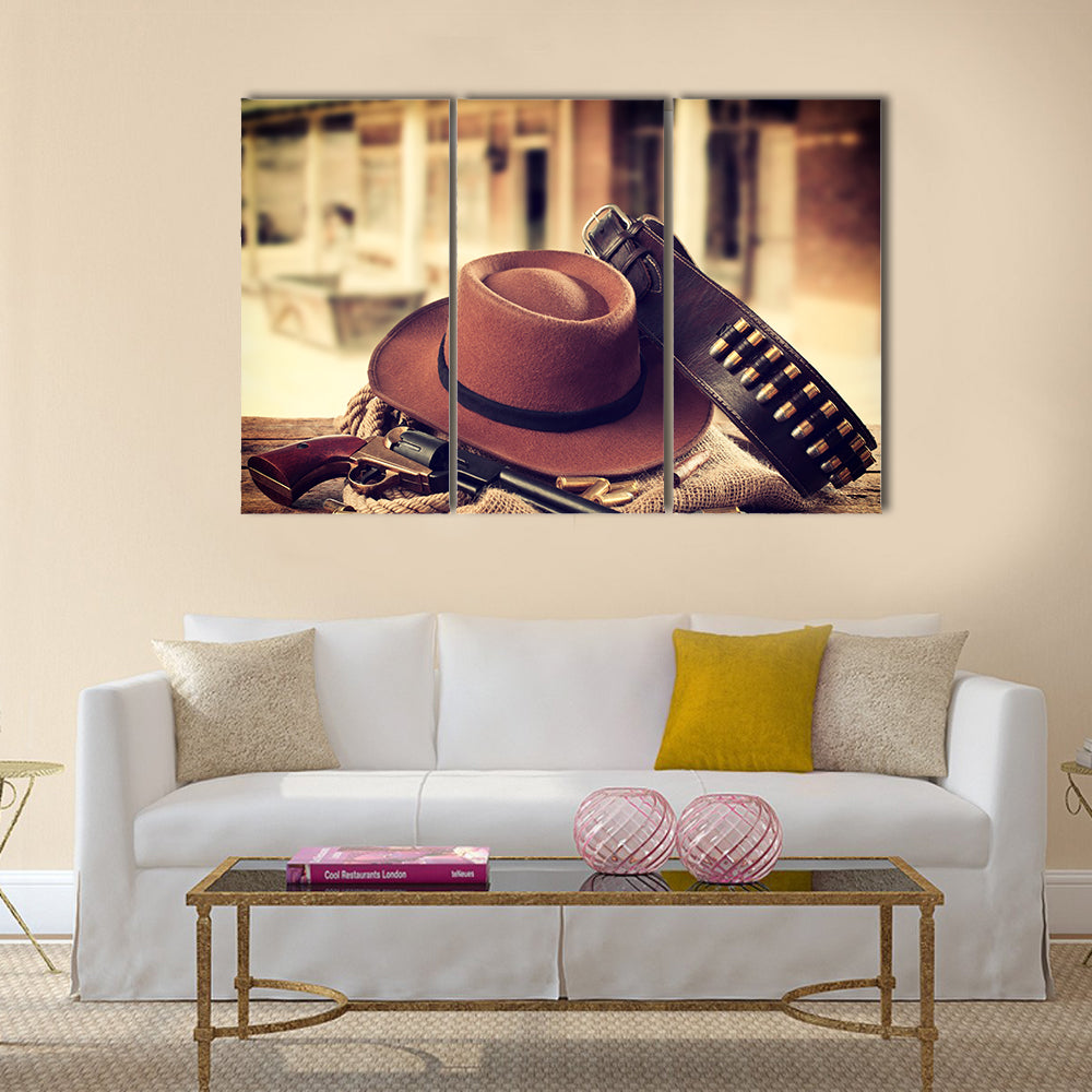 Western accessories on wooden table multi panel canvas wall art