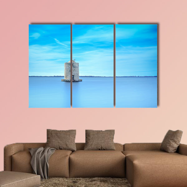 Old spanish windmill in a blue lagoon Molino spagnolo canvas wall art
