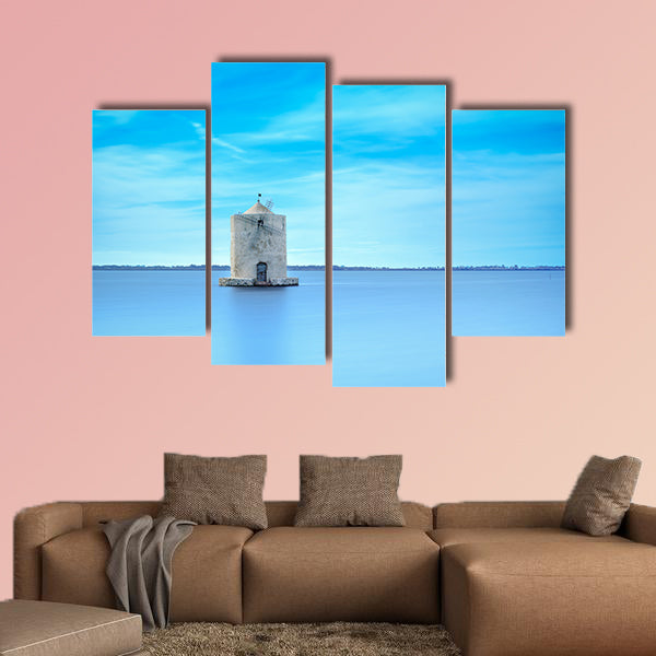 Old spanish windmill in a blue lagoon Molino spagnolo canvas wall art