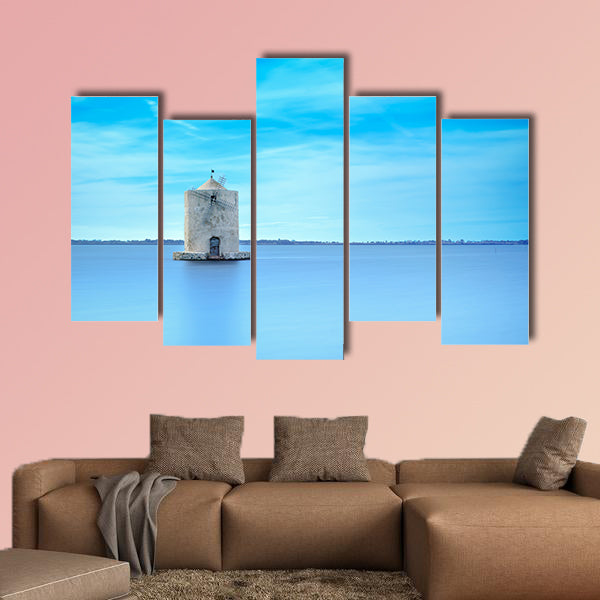 Old spanish windmill in a blue lagoon Molino spagnolo canvas wall art