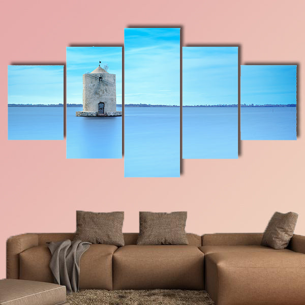 Old spanish windmill in a blue lagoon Molino spagnolo canvas wall art