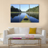 Kayak surfer on a lake Multi panel canvas wall art